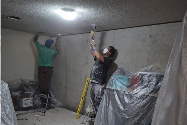 Bathtub and tile restoration crew working home remodeling Bathtub and tile restoration crew working home remodeling