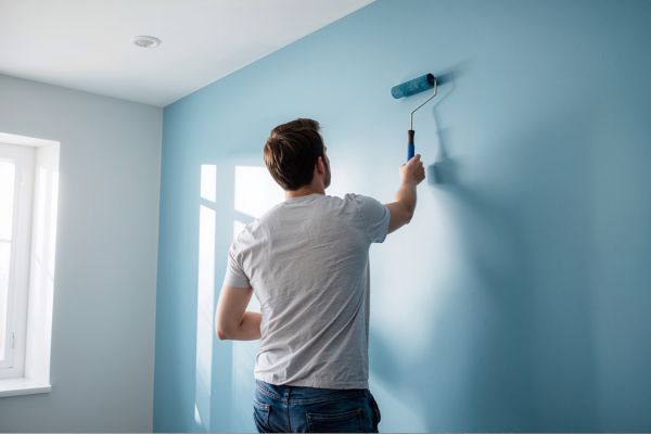 man painting the blue wall.jp man painting the blue wall.jp