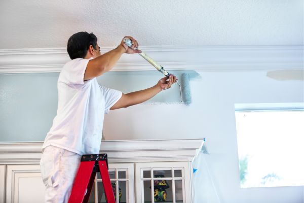 man painting interior man painting interior