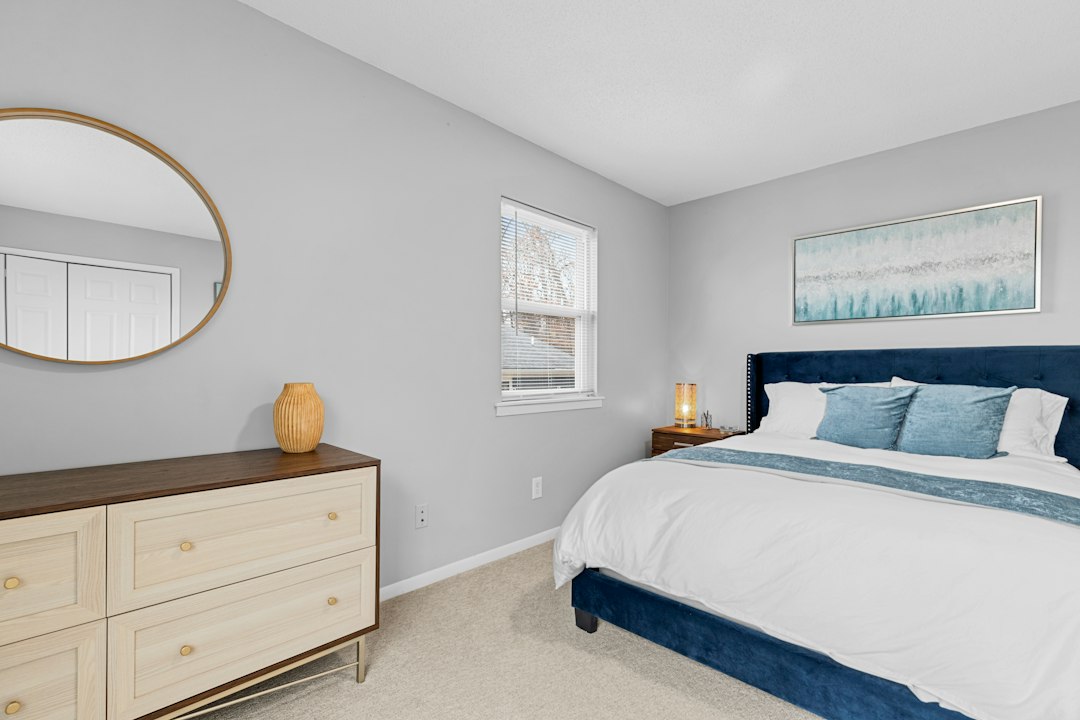 Bright repainted bedroom with finished walls, trim, and ceiling