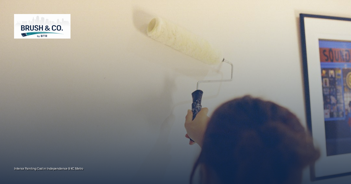 Painter rolling fresh paint on an interior wall in an Independence, MO home